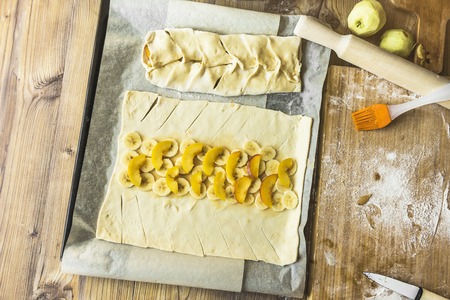 Apple preparing a pie in the kitchen at home