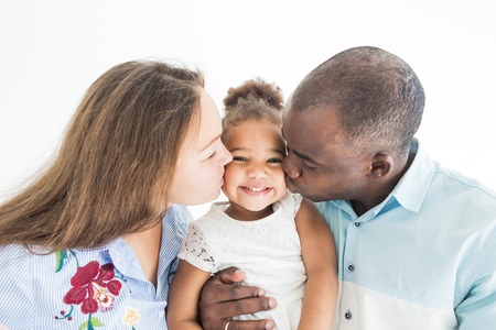 Family portrait on a white background. Happy multiethnic family. Family valuesの写真素材