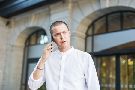 Young business man outdoors work occupation lifestyle, waiting for a meeting with the client, partnerの写真素材