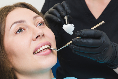 Dental clinic. Reception, examination of the patient. Teeth care. Work of stomatologist with patientの写真素材