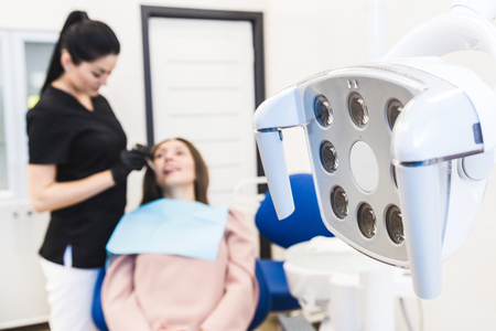 Dental clinic. Reception, examination of the patient. Teeth care. Modern dental equipment.の写真素材