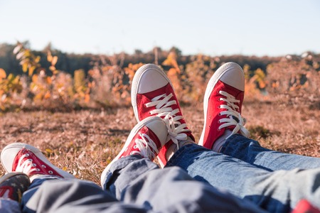 Young happy family with childrens having fun in nature. Young parents are resting on a picnicの写真素材