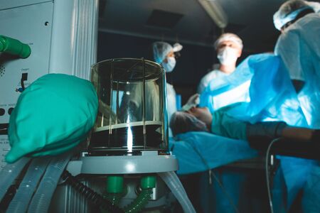 Respiratory ventilation apparatus close up and team of doctors onthe background. artificial respiration.の写真素材