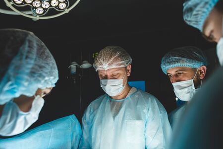 The senior surgeon in the operating room, where the patient is waiting for him, and he begins the...