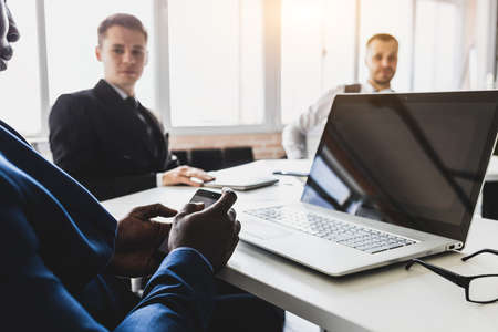 Group of young business people in smart casual wear working together in office. Team at work.の写真素材