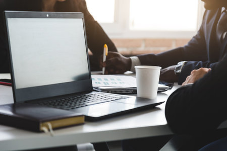 Business concept photo. Close-up laptop on the table during a business conference.の写真素材