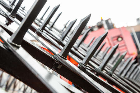 Close-up of technical units and mechanisms of agricultural machinery. Structural elements for...