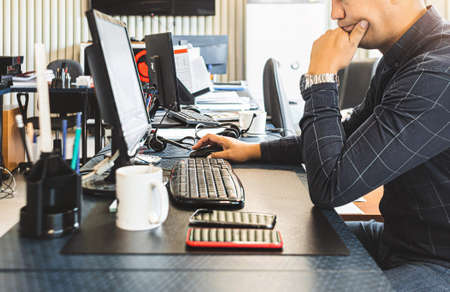 Engineer designer working on desktop computer in factoryの写真素材