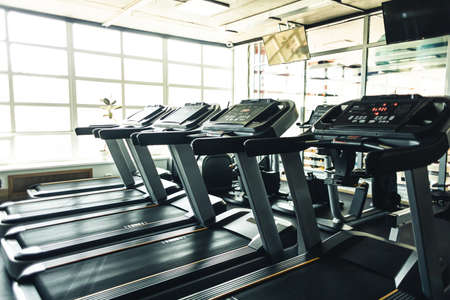 Running simulators in the gym interior. Empty fitness rooms without peopleの写真素材