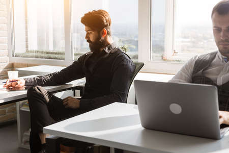 young business man work in modern office on computerの写真素材