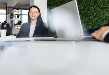 Group of young business people in smart casual wear working together in office. Team at work.の写真素材