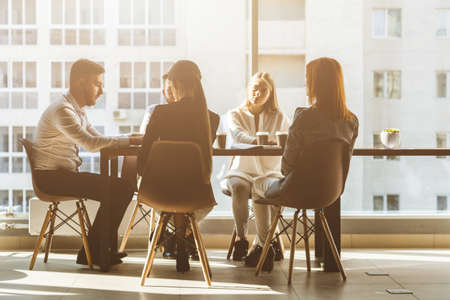 A team of young businessmen working and communicating together in an office. Corporate businessteam...