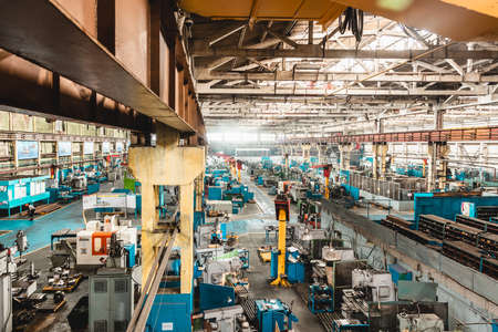 Ufa, Russia. October 9, 2021: The interior of an old manufacturing plant. Large hangar in a factory with many special machines and technological equipment without peopleのeditorial素材