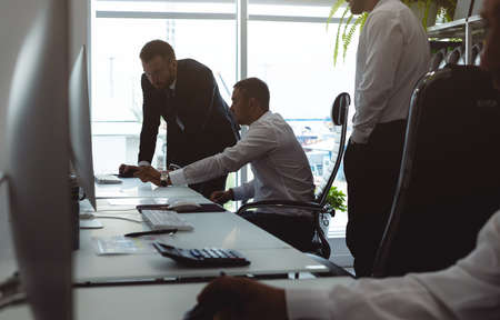 The chief manager and employees of the company interact and talk in the office. Meeting of the head...