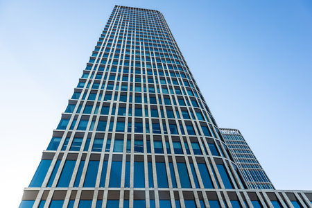 October 15, 2022 Astana, Republic of Kazakhstan:Skyscraper building against the blue sky close upのeditorial素材