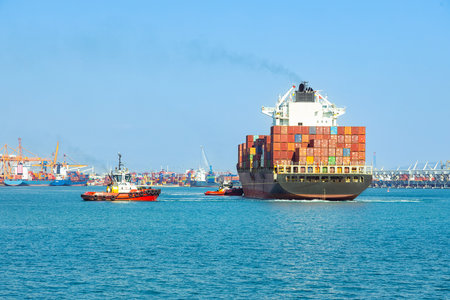 Large cargo container ship sails in the seaportの写真素材