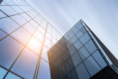Sunset reflected off modern glass facades of skyscrapers in the financial center of the cityの写真素材