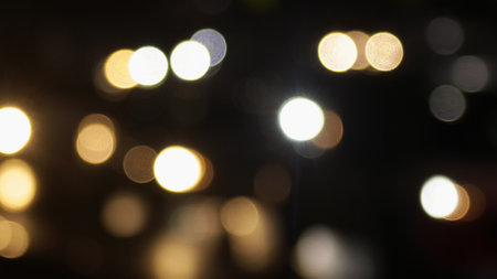 Blurred defocused image of evening car traffic in a big city. Cars in motion and standing in traffic jams. Long exposure exposure and headlight trailsの写真素材