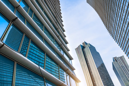 Sunset reflected off modern glass facades of skyscrapers in the financial center of the city