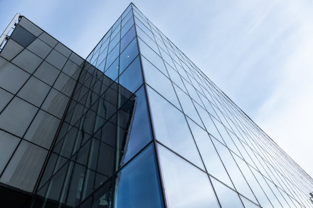 Sunset reflected off modern glass facades of skyscrapers in the financial center of the cityの写真素材