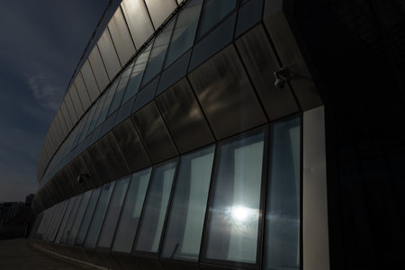 Sunset reflected off modern glass facades of skyscrapers in the financial center of the cityの写真素材