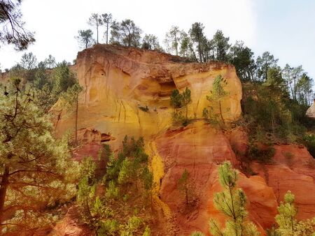 Provence is the southern region of France. Natural Geology Park in Roussillon. Remains of a mining ocher quarry. Famous tourist spot of the European continent. Martian landscape of orange cliffs.の写真素材