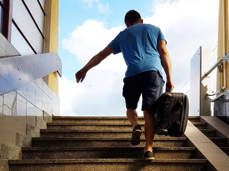 A young guy with a travel suitcase runs up the stairs from the underpass. The thief escapes with...