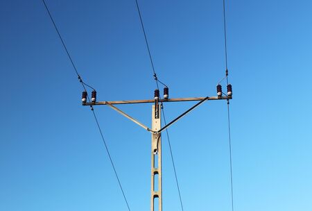 Electrical network of high voltage. Transportation of electricity through the high-voltage line....