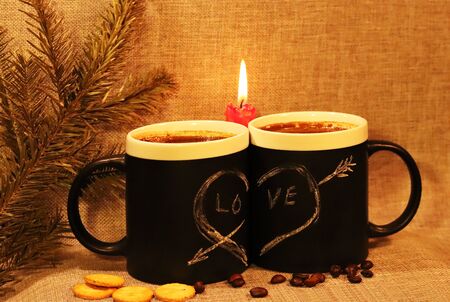 Two black circles with a symbol of love with a red candle and a branch of spruce. Heart pierced by...
