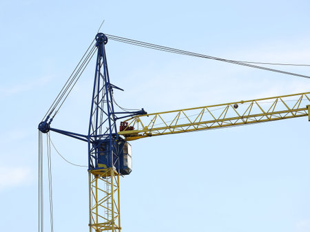 Tower cranes work during the construction of a multi-story building. New apartments for residents...