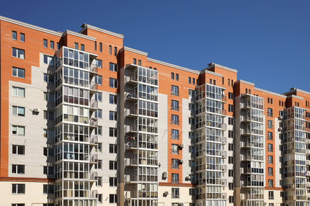 Lviv, Ukraine - 3 4 2020: Facade of a tall multi-storey modern house with balconies and large glass...