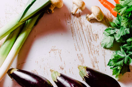 Vegetable still life. Composition with celery, carrots, eggplants, mushrooms and leeks. Healthy living concept. Image with copy-spaceの写真素材