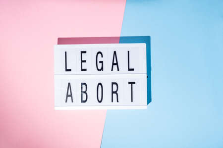 Fight sexism text on the lightbox. Feminism concept. Top view.の写真素材