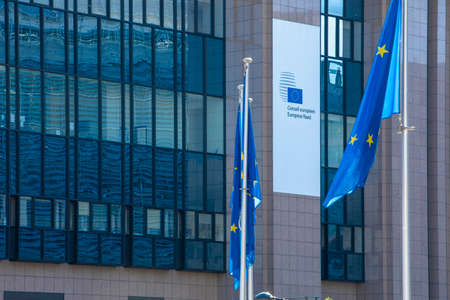 BRUSSELS, Belgium - fourth of may 2020: European Council. European flags floating in front of the European Council, Brussels, Belgiumのeditorial素材