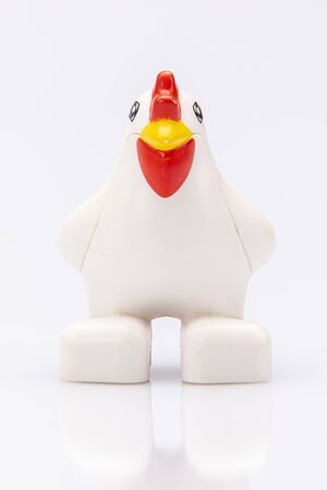 close up of a plastic toy hen isolated on a white backgroundの写真素材