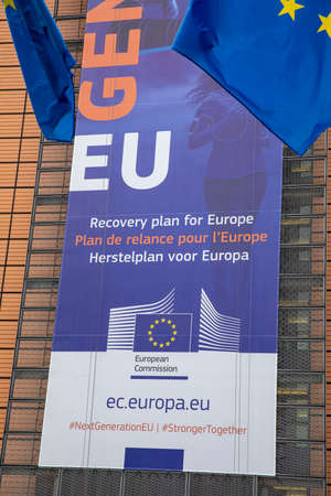 BRUSSELS, Belgium -July 1st, 2020: European flags in the wind in front of The Next Generation EU...