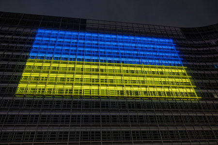 BRUSSELS, Belgium - February 23, 2023: Berlaymont building, seat of the European Commission, with the Ukrainian flag projected on the facade in solidarity with Ukraineのeditorial素材
