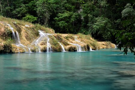 The Cahabon River, as it passes through Semuc Champey, in Guatemala, is transformed into small...