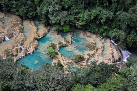 The Cahabon River, as it passes through Semuc Champey, in Guatemala, is transformed into small waterfalls and pools, suitable for swimming.の写真素材