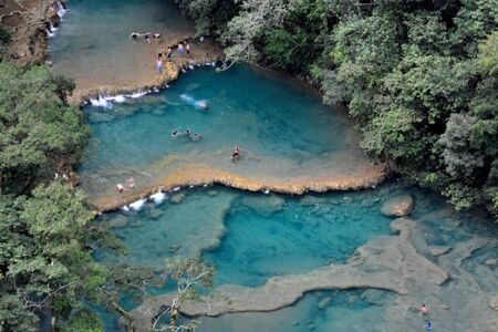 The Cahabon River, as it passes through Semuc Champey, in Guatemala, is transformed into small waterfalls and pools, suitable for swimming.の写真素材