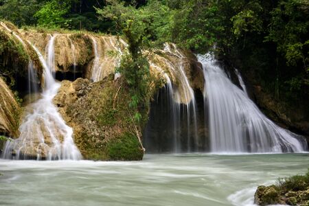 The Cahabon River, as it passes through Semuc Champey, in Guatemala, is transformed into small waterfalls and pools, suitable for swimming.の写真素材