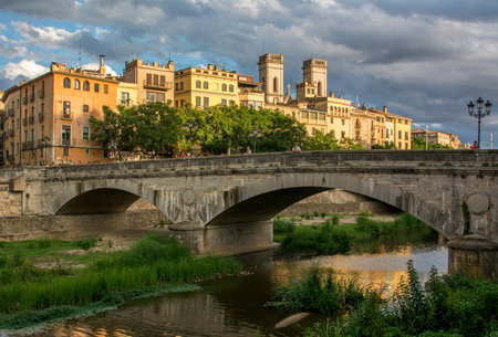 Sunset reflected in the houses of the old town of Girona, in the northeast of Cataloniaの写真素材