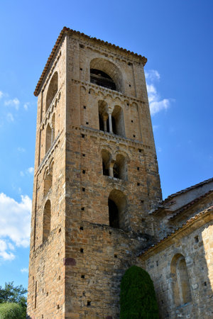 Exterior and bell tower of the Romanesque church of the tourist town of Beget, in the ripolles region, in the northeast of Cataloniaの写真素材