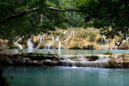 Landscapes of stepped pools of water, all turquoise in color in the CahabÃ³n River, as it passes through the Semuc Champey Park, in the jungle of central Guatemalaの写真素材