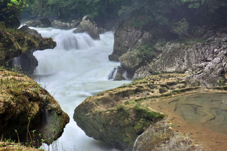 Landscapes of stepped pools of water, all turquoise in color in the CahabÃ³n River, as it passes through the Semuc Champey Park, in the jungle of central Guatemalaの写真素材