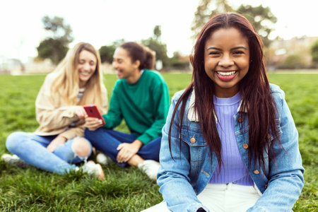 Portrait of young latin american student woman smiling at camera outdoorsの写真素材