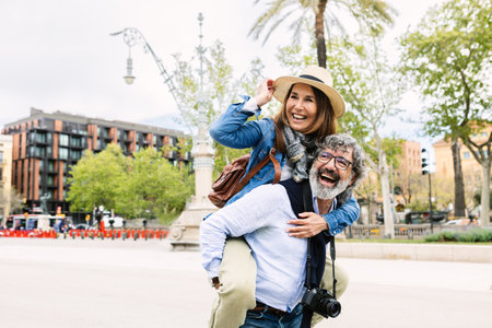 Happy elderly married couple having fun enjoying summer vacation together.の写真素材