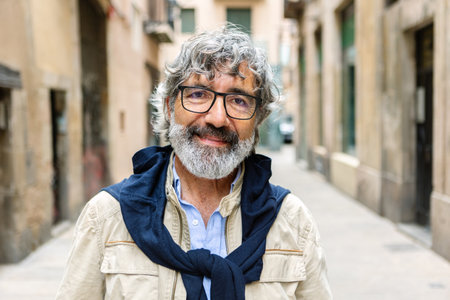 Smiling portrait of 60s middle aged man looking at camera.の写真素材