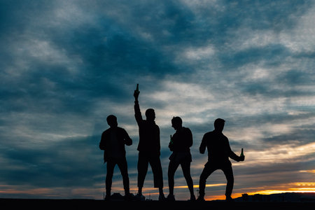 Young friends having fun partying together outdoorsの写真素材