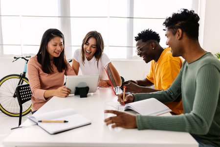 Young group of high school students learning together at home